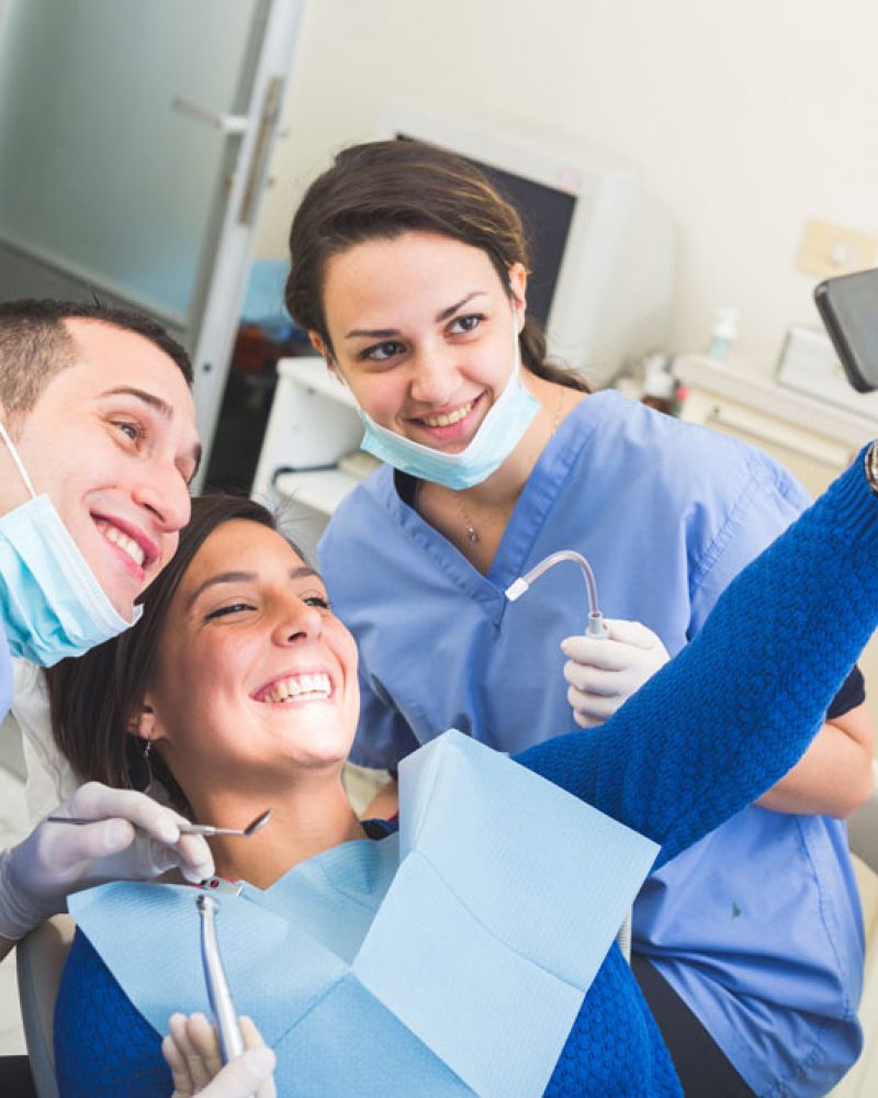 Dental-patient-and-dentist-taking-pictures-Stock-Photo-web